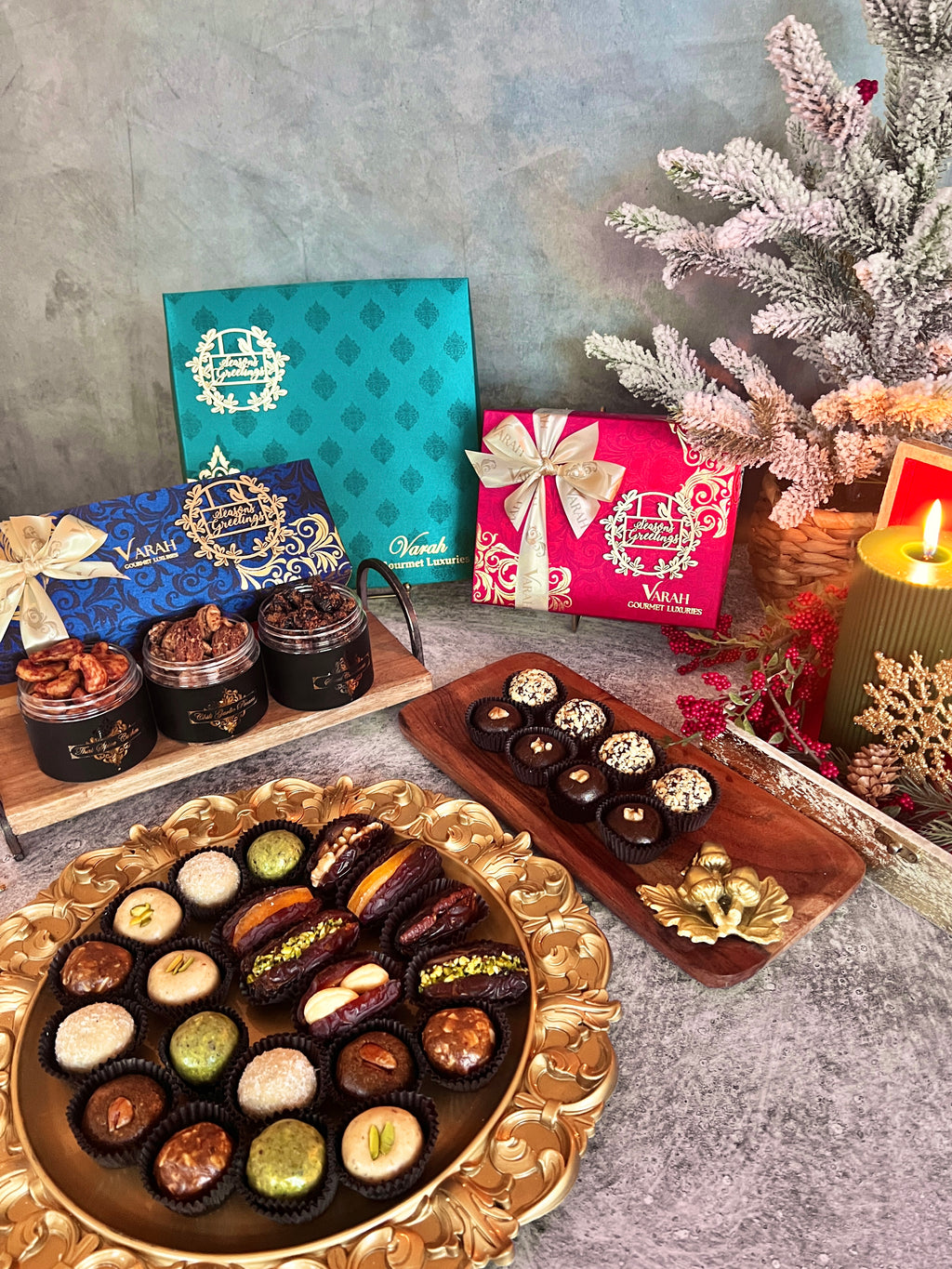 Varah holiday gift boxes and snack jars displayed with stuffed dates and assorted bites.